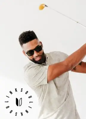 man golfing with sunglasses on